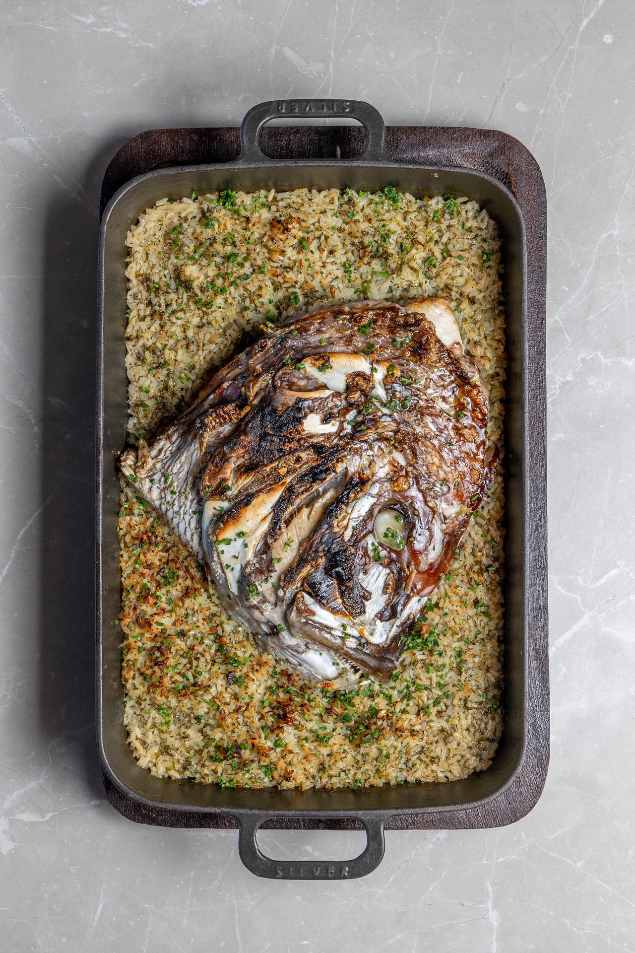 SEA BREAM HEAD WITH RICE AND HERBS